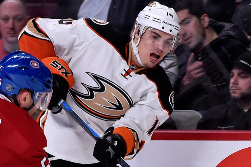 Ducks forward Rene Bourque, right, passes in front of Montreal Canadiens defenseman Sergei Gonchar during the Ducks' 2-1 win on Dec. 18.