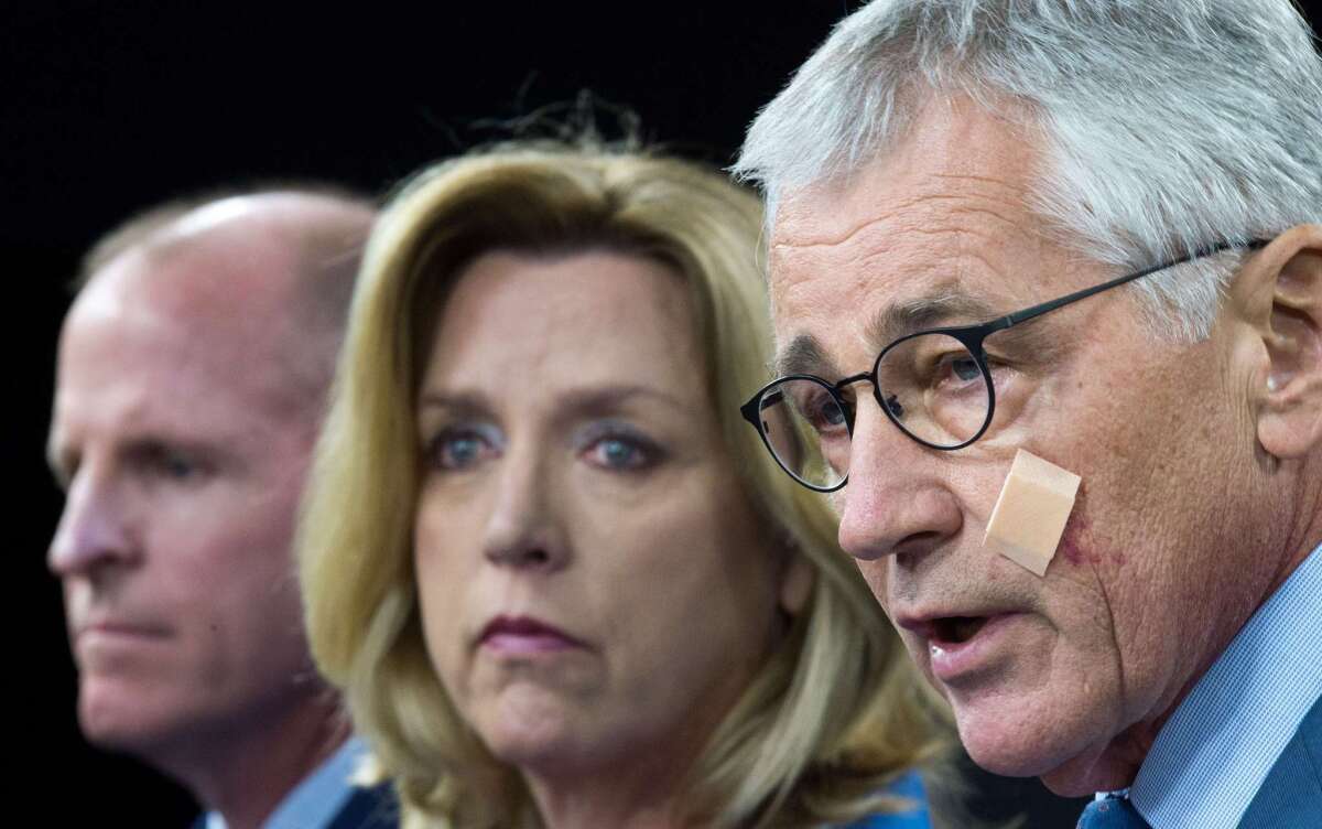 Defense Secretary Chuck Hagel, right, is joined by Secretary of the Air Force Deborah Lee James and Lt. Gen. Stephen Wilson, head of the Air Force Global Strike Command, to discuss management of the U.S. nuclear arsenal.