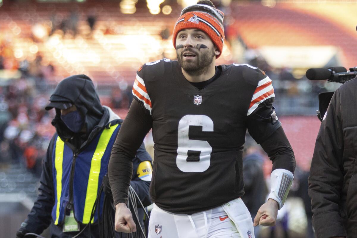 FILE - Then-Cleveland Browns quarterback Baker Mayfield (6) walks off the field after an NFL football game, Sunday, Dec. 12, 2021, in Cleveland. The Panthers view their starting QB job as an open competition between the newly acquired Baker Mayfield and incumbent Sam Darnold, one that will ultimately be decided at training camp and in preseason games. (AP Photo/Matt Durisko, File)