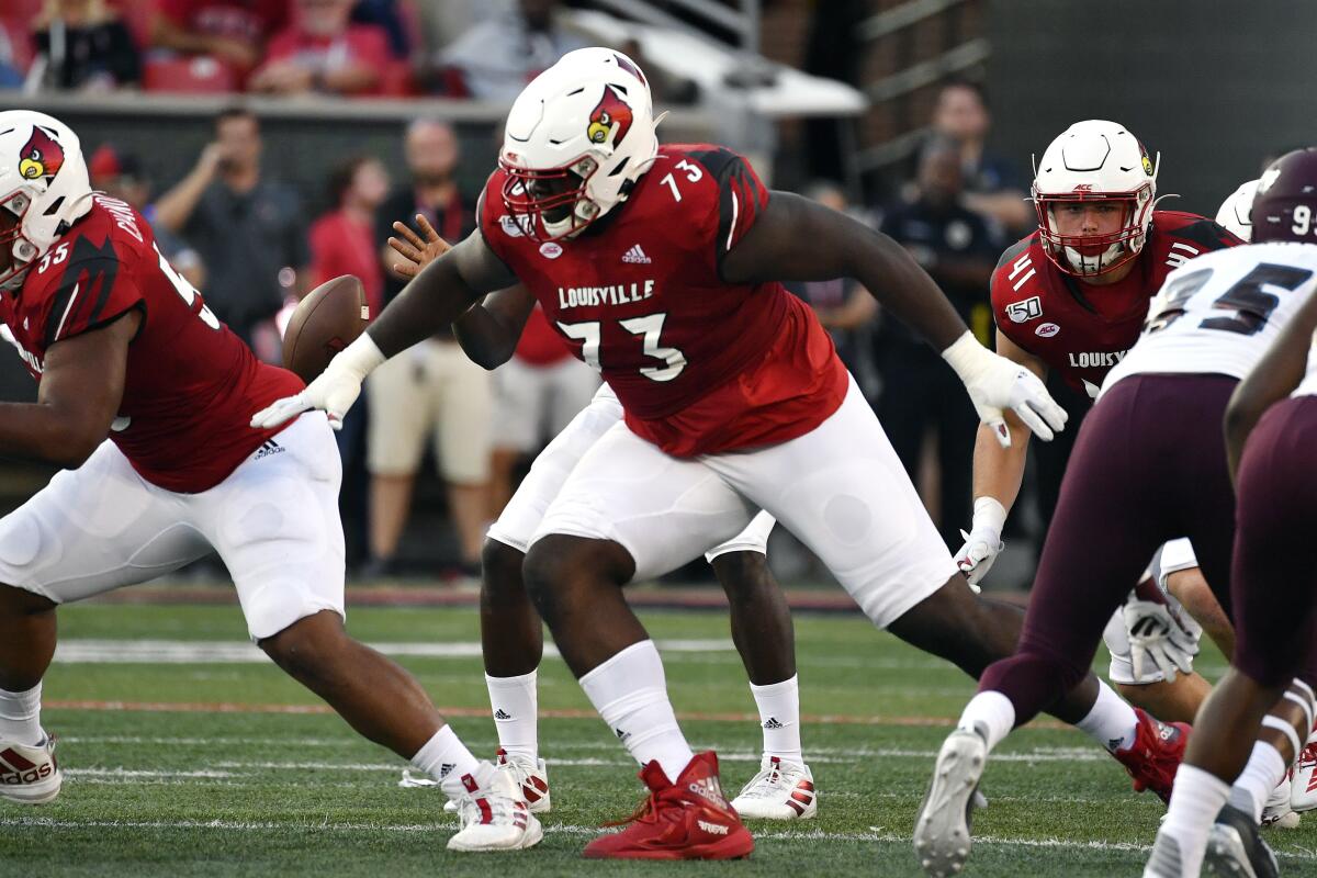 Louisville offensive lineman Mekhi Becton blocks during a game against Eastern Kentucky.