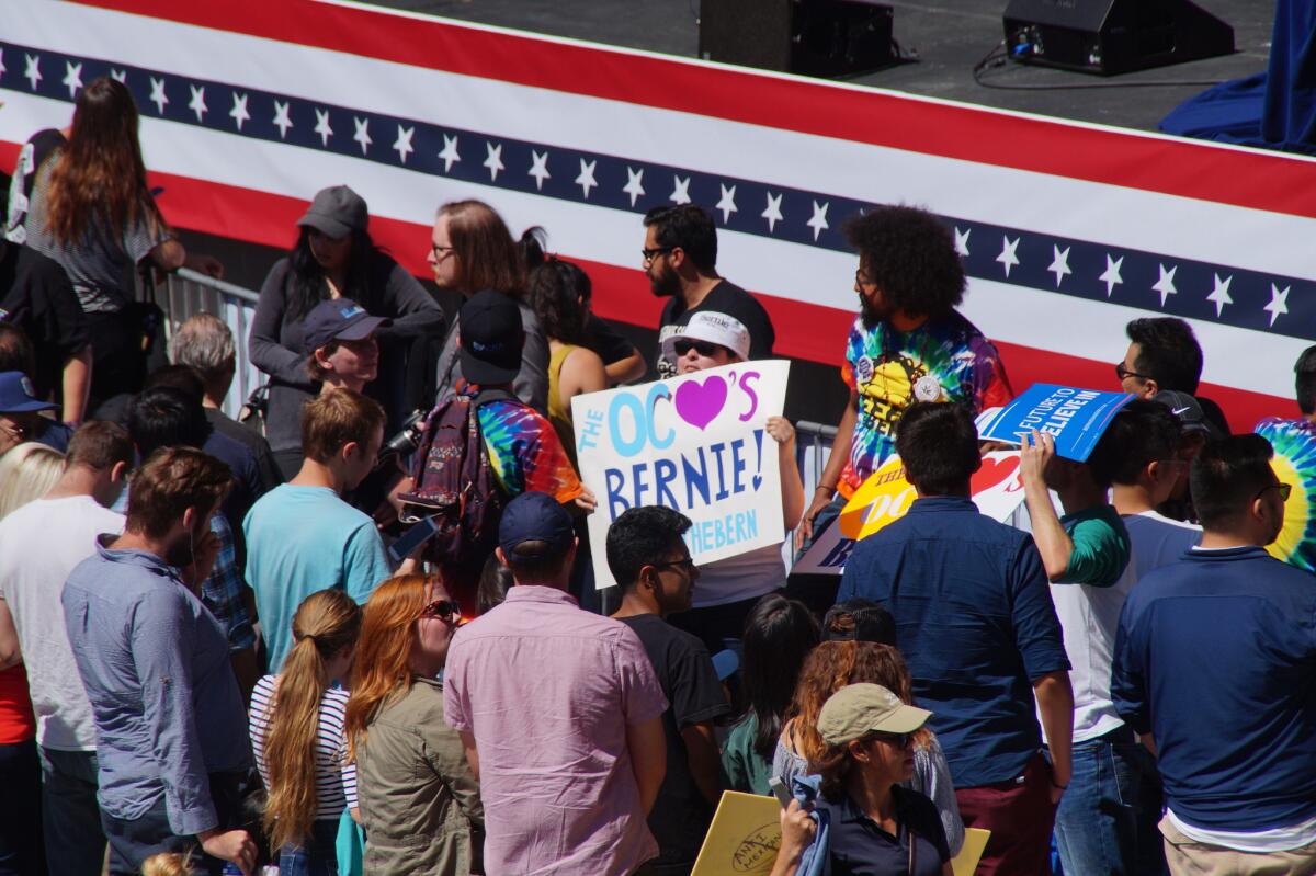 Supporters of Democratic presidential candidate Bernie Sanders began gathering in front of the Irvine Meadows Amphitheatre stage around 3 p.m. Sunday, three hours before he was scheduled to speak at a campaign rally.