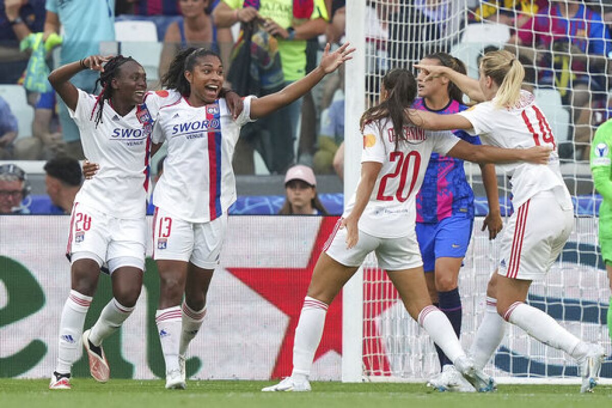 Olympique Lyon's Catarina Macario, second left, celebrates after scoring her side's third goal during the Women's Champions League final soccer match between Barcelona and Olympique Lyonnais at Allianz Stadium in Turin, Italy, Saturday, May 21, 2022.(Spada/LaPresse via AP)