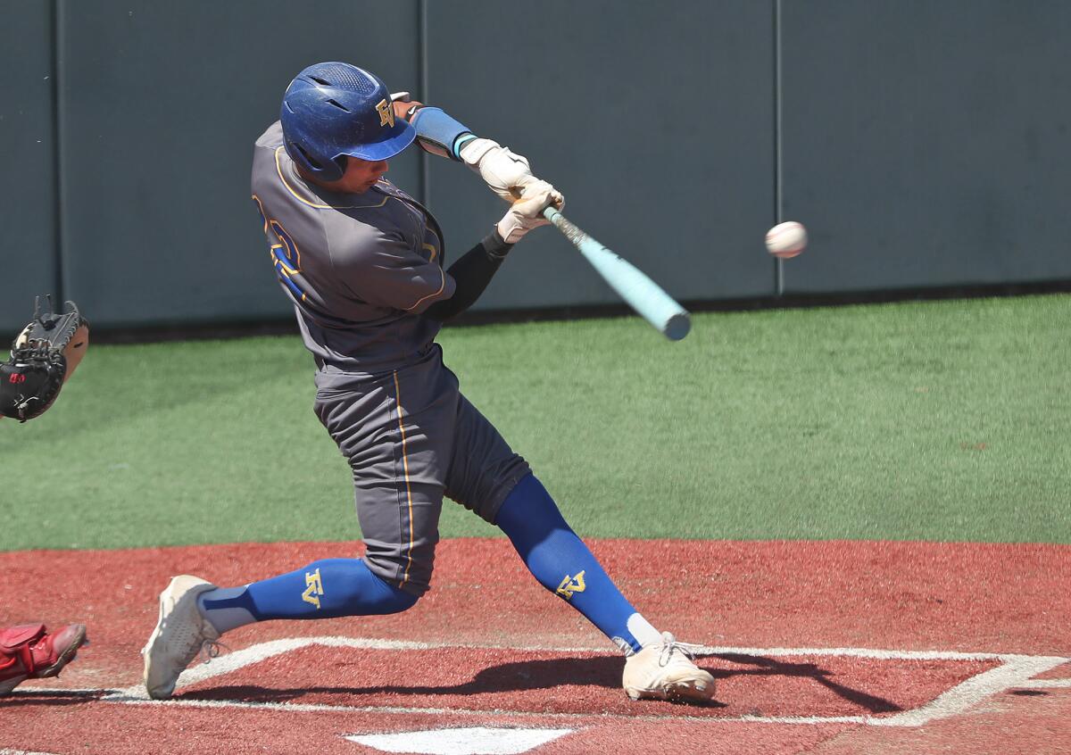 Fountain Valley's Anthony Zamora (12) slugs a leadoff single.