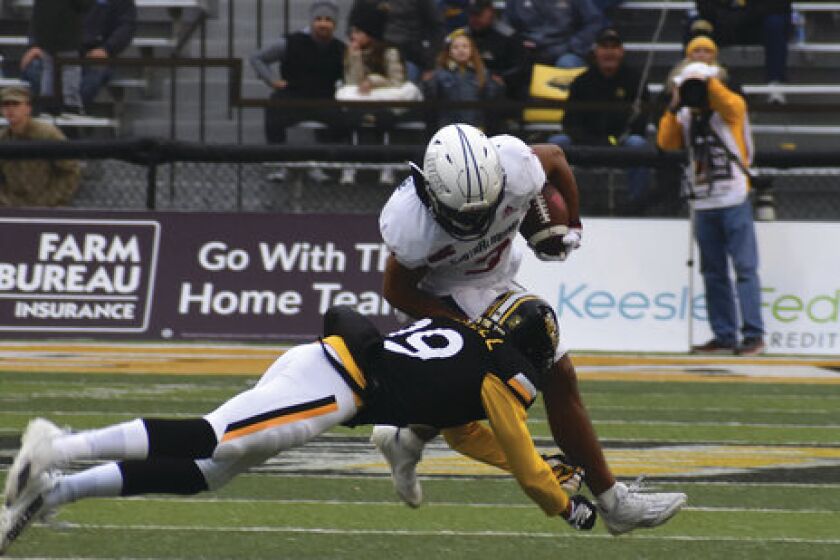 South Alabama Receiver Devin Voisin tries to break the tackle from Southern Miss Safety Camron Harrell in the first half of an NCAA college football game on Saturday, Nov. 19, 2022, in Hattiesburg, Miss. (Aimee Cronan/The Gazebo Gazette via AP)