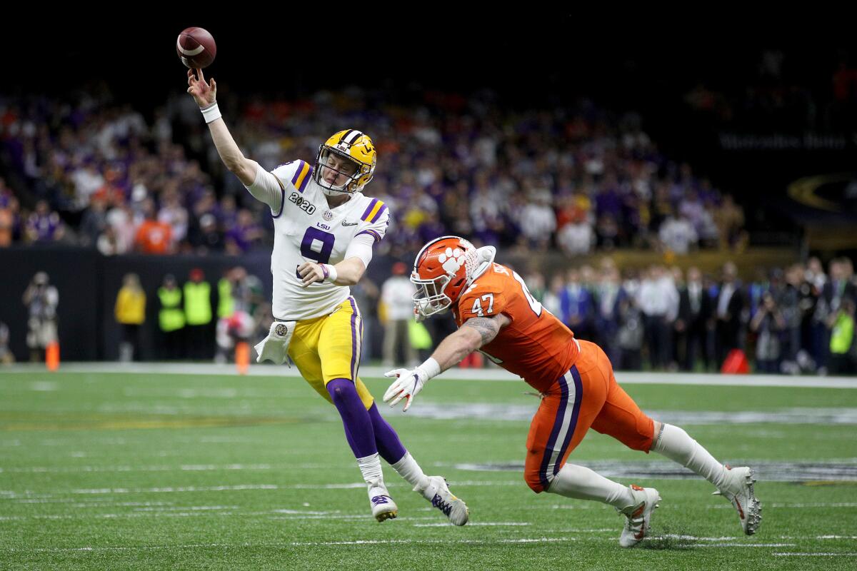 NEW ORLEANS, LOUISIANA - JANUARY 13: Joe Burrow #9 of the LSU Tigers throws the ball under pressure as James Skalski #47 of the Clemson Tigers tries to defend during the College Football Playoff National Championship game at Mercedes Benz Superdome on January 13, 2020 in New Orleans, Louisiana. (Photo by Chris Graythen/Getty Images) ***BESTPIX*** ** OUTS - ELSENT, FPG, CM - OUTS * NM, PH, VA if sourced by CT, LA or MoD **