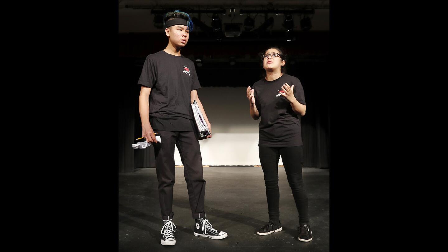 Estancia High School drama students Katherin Hernandez, 16, right, and Makai Walker, 17, go through a scene during rehearsals for "To Whom It May Concern," an original play written by the students that they will be performing from January 17-19.