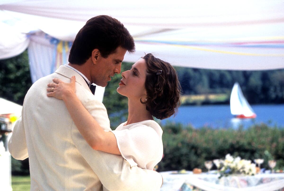 Ted Danson and Isabella Rossellini moving toward a kiss in a scene from the film "Cousins," 1989.