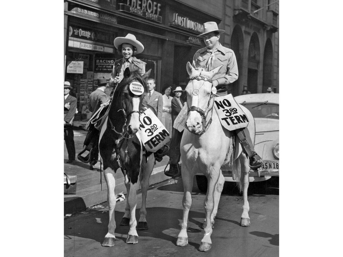 Oct. 23, 1940: Frances Voltz and Les Sachs ride horses down Spring St. during No Third Term Day observances in LA
