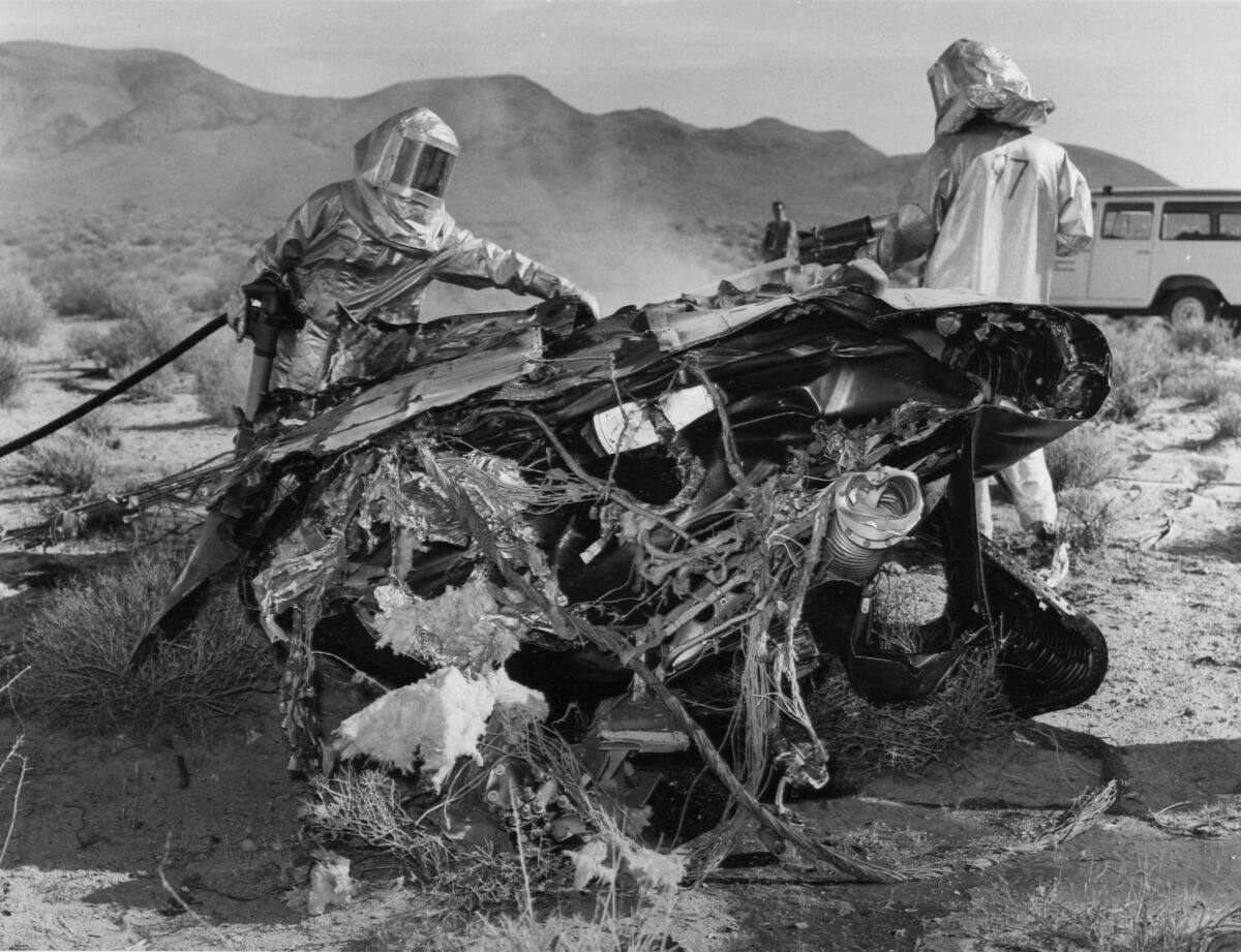 Investigators at the 1967 crash site shortly after a North American Aviation X-15 rocket plane broke up at 62,000 feet while traveling at 4,000 mph.