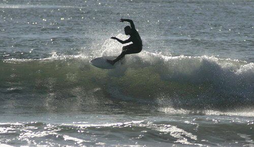 A surfer takes on a wave at the Lower Trestles, in Sna Onofre. The California Coastal Commission voted against a new toll road that would have gone through the State Park.