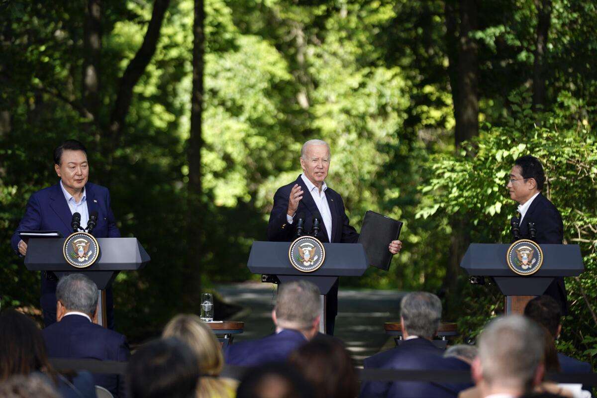 President Joe Biden, center, reacts during a news conference with Japan's Prime Minister Fumio Kishida