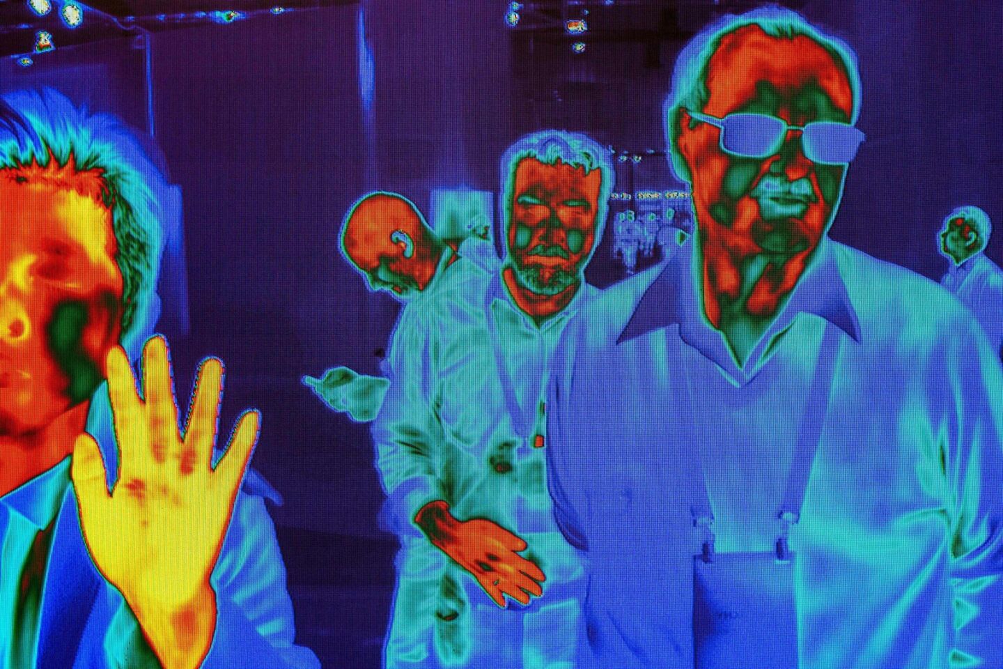People are captured by FLIR (Forward-Looking Infrared) HD Thermal Imaging Cameras as they walk near the FLIR exhibit at the Las Vegas Convention Center during CES 2019 in Las Vegas.