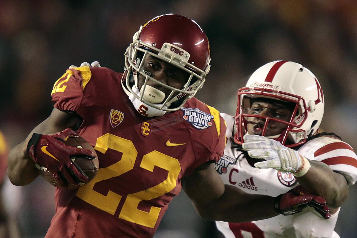 USC tailback Justin Davis, seen here in the Holiday Bowl against Nebraska, will get the majority of the carries during USC's spring practices with Tre Madden still not a full participant.