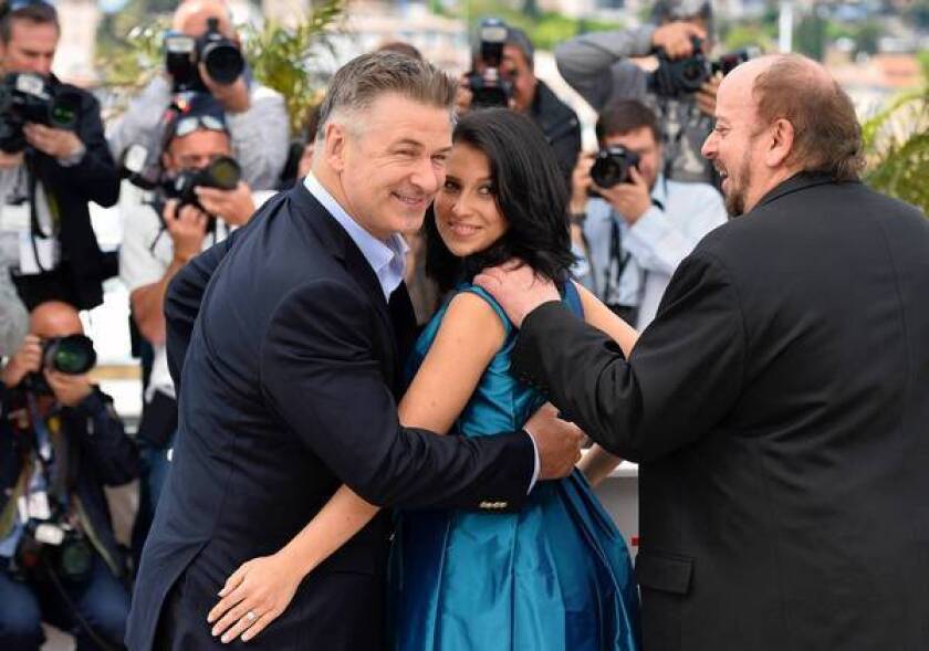 Actor Alec Baldwin, left, his wife, Hilaria Thomas, and director James Toback during a photocall May 21, 2013, for the film "Seduced and Abandoned" at the 66th edition of the Cannes Film Festival in Cannes.