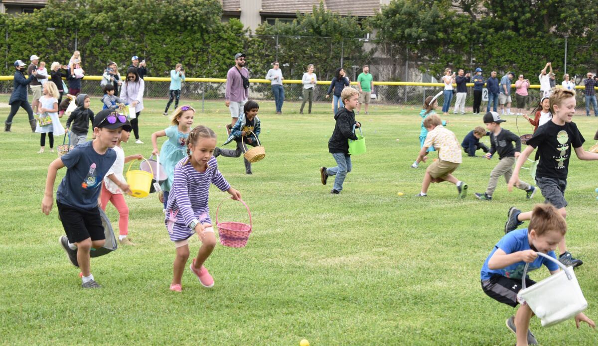 Children participating in the Westwood Club’s 2022 Easter egg hunt.