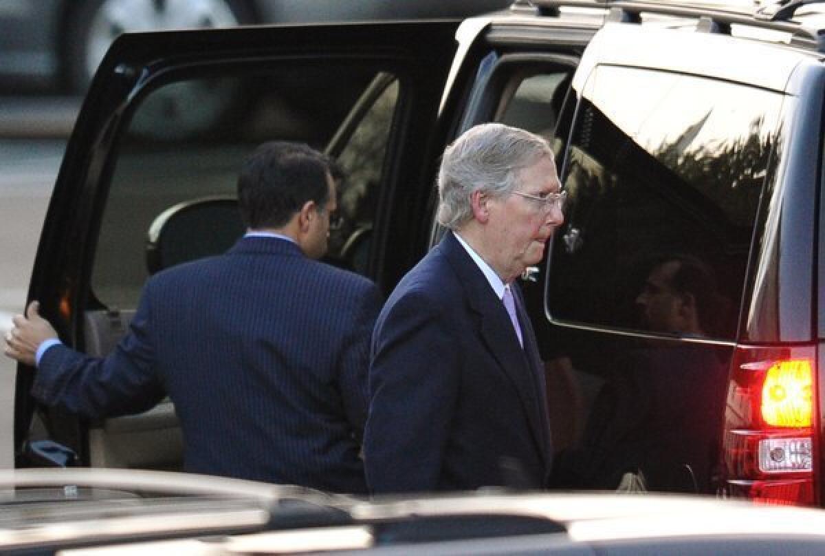 Senate Minority Leader Mitch McConnell (R-Ky.) departs from the White House after talks with President Obama aimed at avoiding the "fiscal cliff."