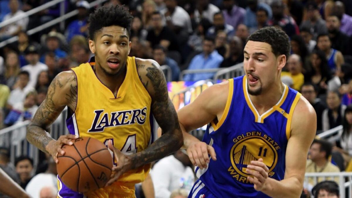 Laker rookie guard Brandon Ingram drives against Warriors guard Klay Thompson during a game on Oct. 15.