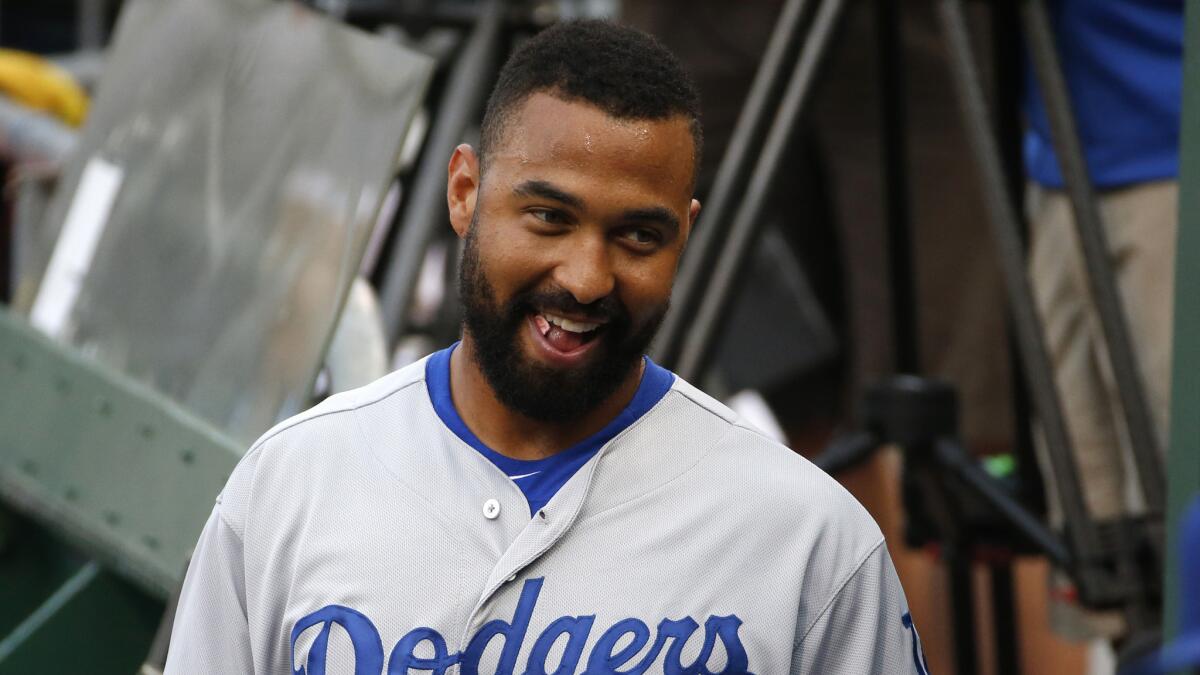 Dodgers right fielder Matt Kemp smiles in the dugout before the team's 5-2 victory over the host Pittsburgh Pirates on Monday.