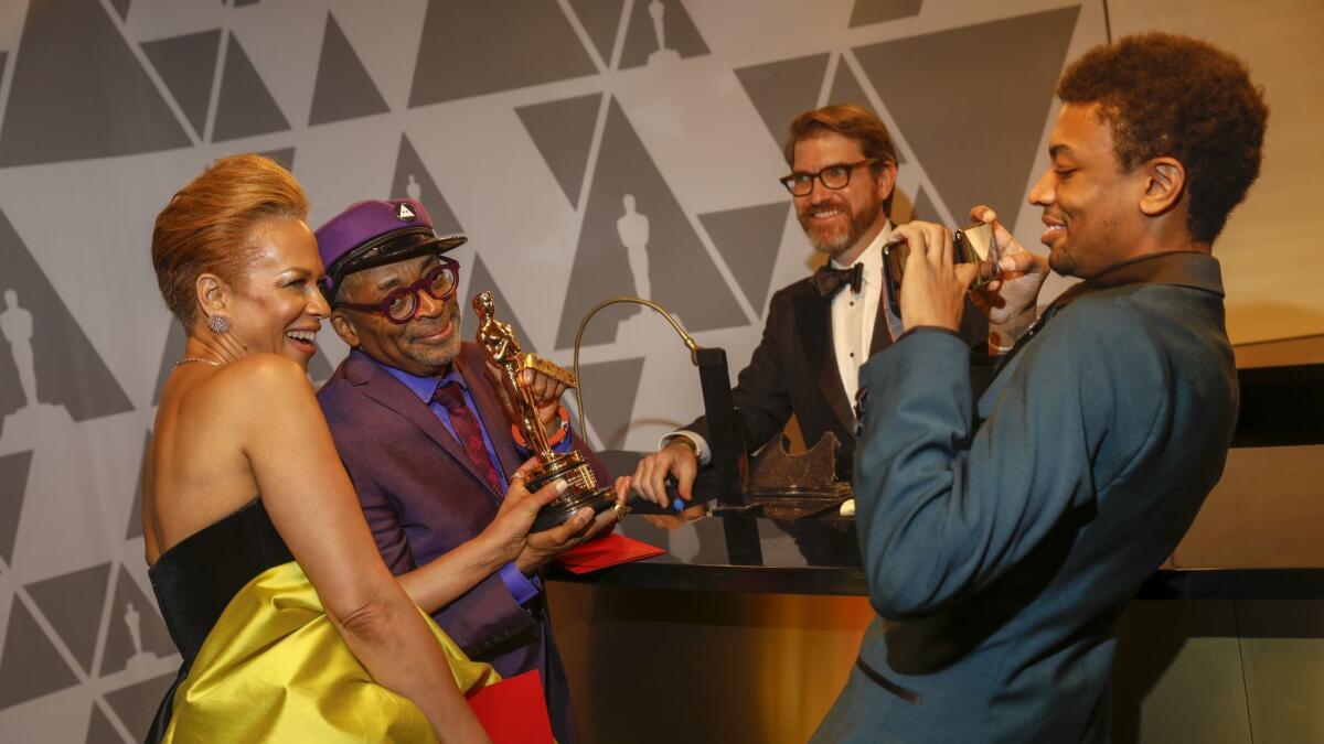 Tonya Lewis Lee and Spike Lee and are photographed by son Jackson Lee.