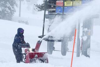 An employee at Alpine clears snow. The resort was closed on March 1 due to the blizzard.