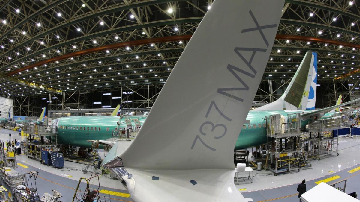 The distinctive winglet on a Boeing 737 Max airplane is shown on the assembly line in Renton, Wash., in 2015. Two 737 Max jetliners were involved in fatal crashes in the last six months.