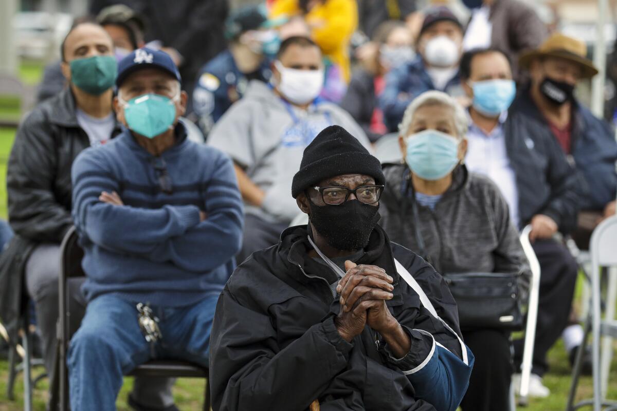 Anthony Angulo waits to get a COVID-19 vaccination at  the South Park Recreation Center 