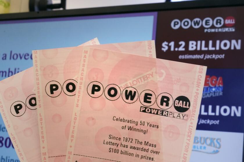 FILE - A selection of Powerball tickets are shown at the Route One Wine and Spirits liquor store, Wednesday, Nov. 2, 2022, in Foxborough, Mass. Another Powerball drawing Saturday, Sept. 30, 2023, another chance at a jackpot that is inching toward $1 billion.(AP Photo/Charles Krupa, File)