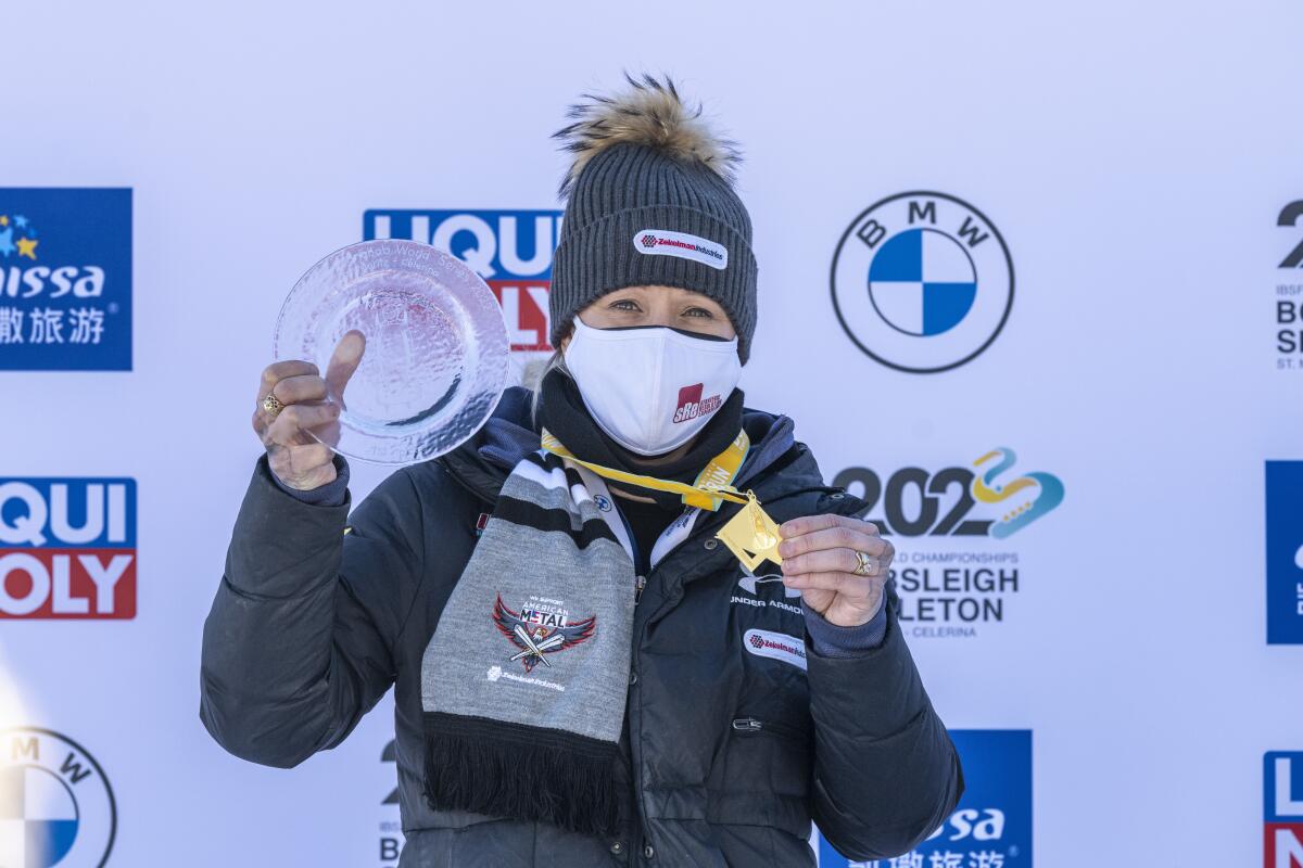 Winner Kaillie Humphries of USA on the podium after the Women's Monobob World Cup in St. Moritz, Switzerland, on Saturday, Jan. 15, 2022. (Mayk Wendt/Keystone via AP)