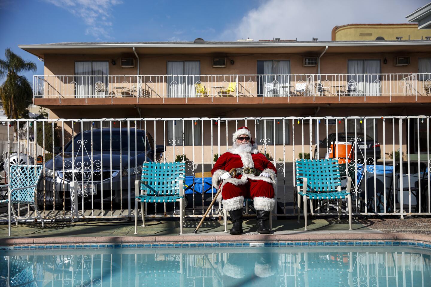 An actor in Santa clothing gets in his "background" position at a motel in Hollywood during filming of FX's Season 3 episode of "Fargo" in February.