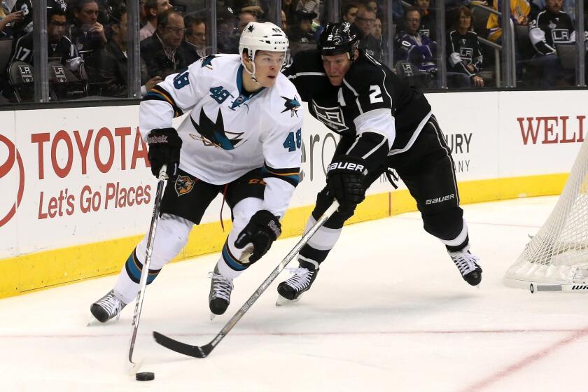 San Jose's Tomas Hertl controls the puck in front of the Kings' Matt Greene at Staples Center on Oct. 30. Greene was to be placed on long-term injured reserve with an upper-body injury.