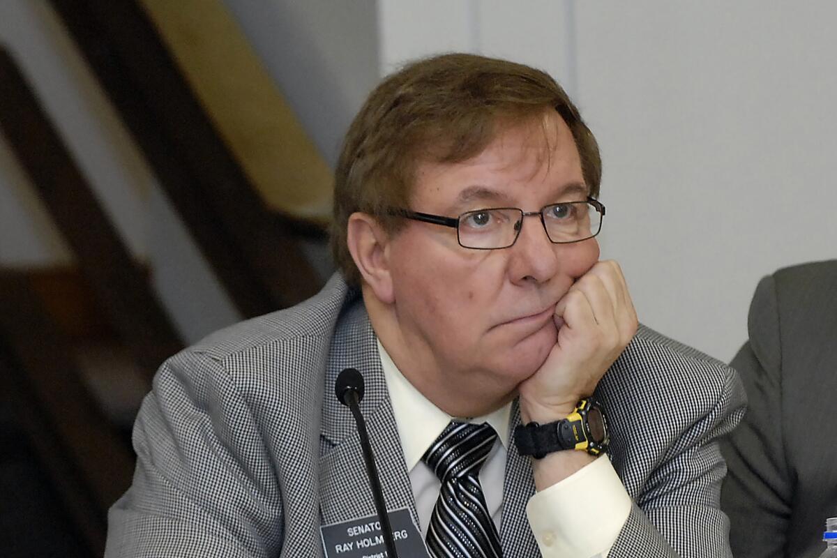 North Dakota Sen. Ray Holmberg listens during a joint House and Senate Appropriations Committee meeting.