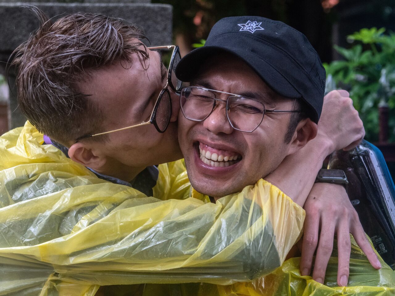 Taiwanese men celebrate in Taipei after the country's parliament voted to legalize same-sex marriage.