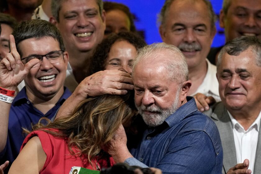 Former Brazilian President Luiz Inacio Lula da Silva embraces his wife Rosangela, after defeating incumbent Jair Bolsonaro in a presidential run-off to become the country's next president, in Sao Paulo, Brazil, Sunday, Oct. 30, 2022. (AP Photo/Andre Penner)
