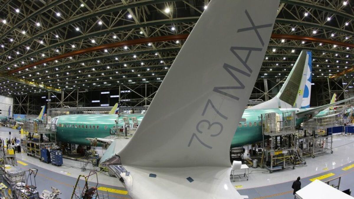 A Boeing 737 Max is assembled at the company's Renton, Wash., plant in 2015. After two fatal crashes, the planes have been grounded and production is being suspended.