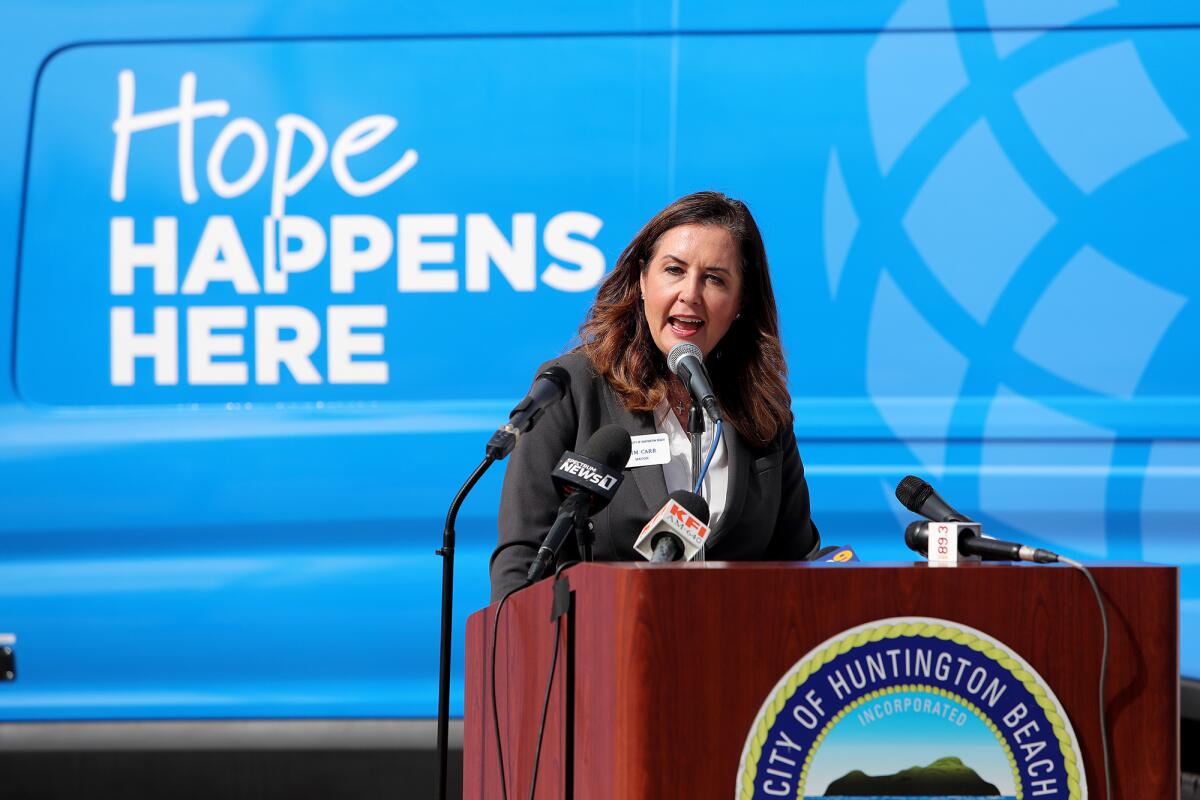 Then-Mayor Kim Carr speaks at a press conference for Be Well OC at Huntington Beach Civic Center Plaza last September.