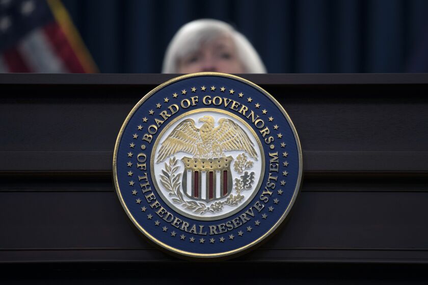FILE - The seal of the Board of Governors of the United States Federal Reserve System is displayed on the desk as Federal Reserve Chair Janet Yellen speaks during a news conference following the Federal Open Market Committee meeting in Washington, Wednesday, Dec. 13, 2017. The Federal Reserve Board has denied a Wyoming cryptocurrency bank's application for Federal Reserve System membership, officials announced Friday, Jan. 27, 2023, a setback for the crypto industry's attempts to build acceptance in mainstream U.S. banking. (AP Photo/Carolyn Kaster, File)
