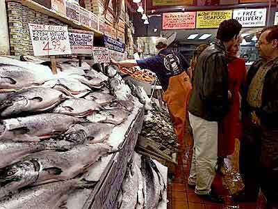 One of many busy seafood counters in Pike Place Market, which is also packed with produce and crafts.