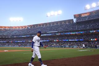 LOS ANGELES, CALIFORNIA - MARCH 30: Mookie Betts #50 of the Los Angeles Dodgers heads to the dugout.