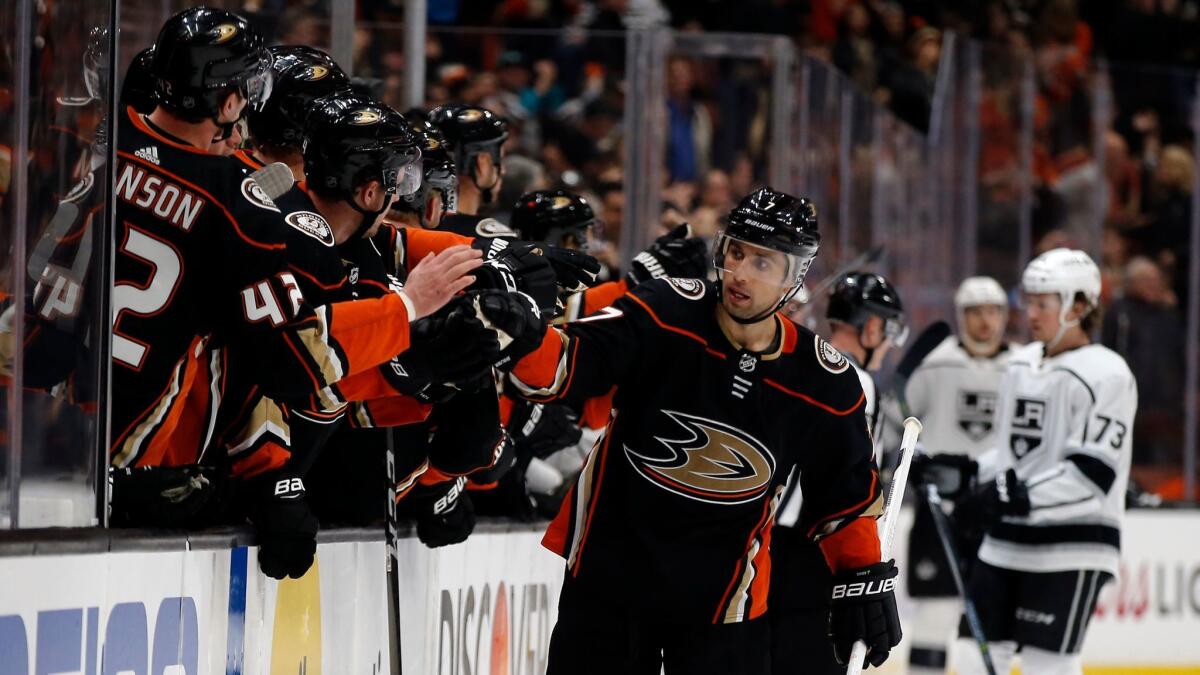 Ducks left wing Andrew Cogliano, back after missing the first games of his career to a two-game suspension, celebrates with teammates after the Ducks scored during the third period against the Kings.
