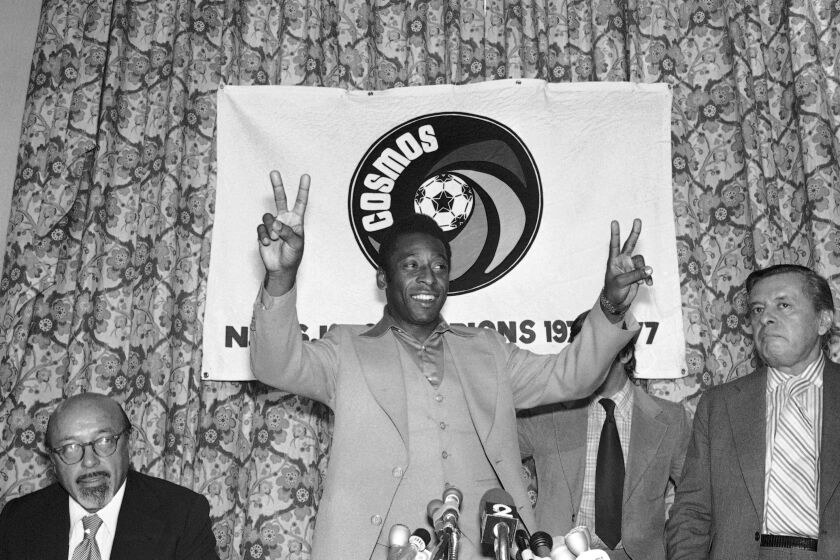 FILE - New York Cosmos' Pele gestures during a press conference in New York, Sept. 29, 1977. After two decades competing against Real Madrid, Manchester United and Brazil, Lionel Messi will be going against the NFL, Major League Baseball and the NBA.(AP Photo/Ira Schwarz, File)