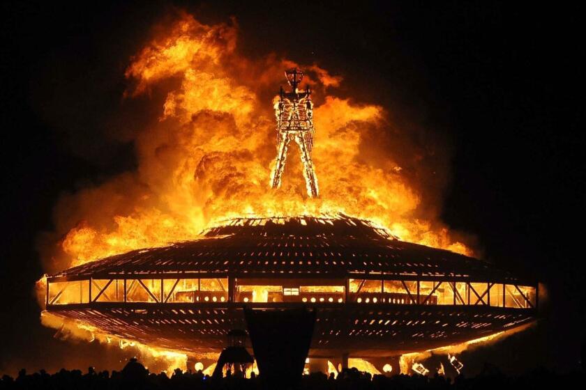 In this Aug. 31, 2013 file photo, the "Man" burns on the Black Rock Desert at Burning Man near Gerlach, Nev. (Andy Barron/The Reno Gazette-Journal via AP)
