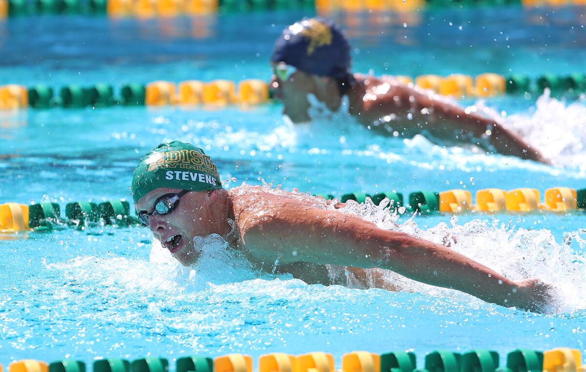Edison's Ryder Stevens swims the butterfly leg of the boys' 200 yard medley relay.