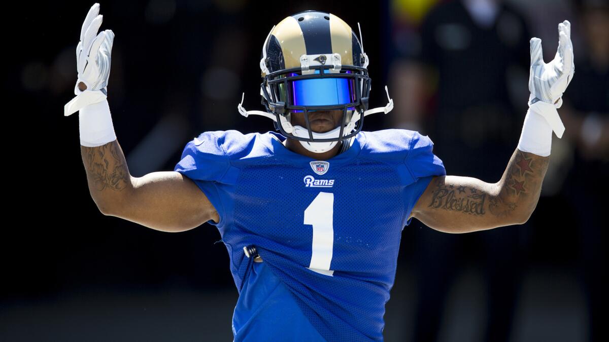 Tavon Austin acknowledges the crowd as he enters the Coliseum for the Rams' scrimmage Aug. 6.