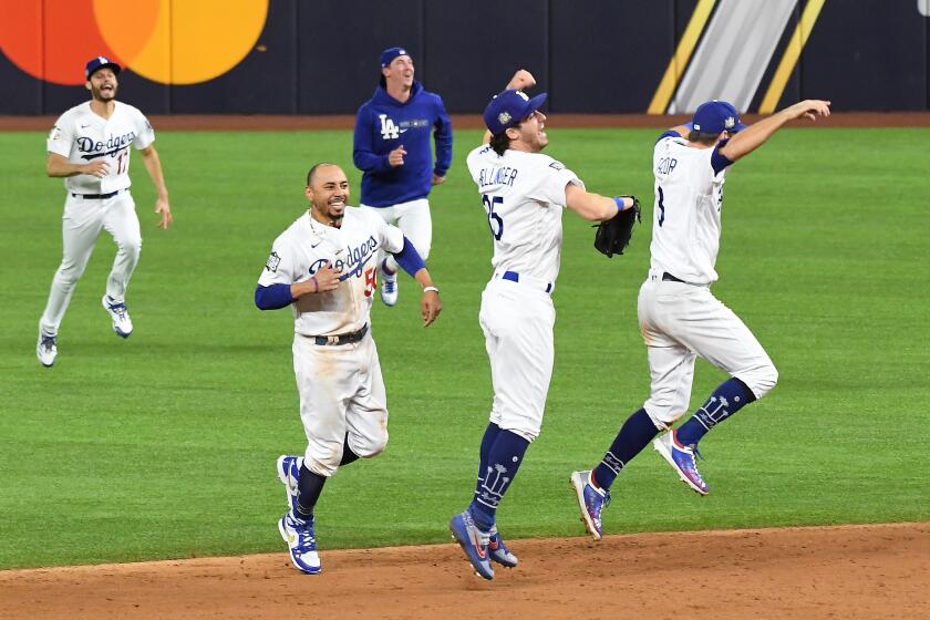 Dodgers players celebrate beating the Rays in Game 6 of the World Series on Oct. 27, 2020, to capture the title.