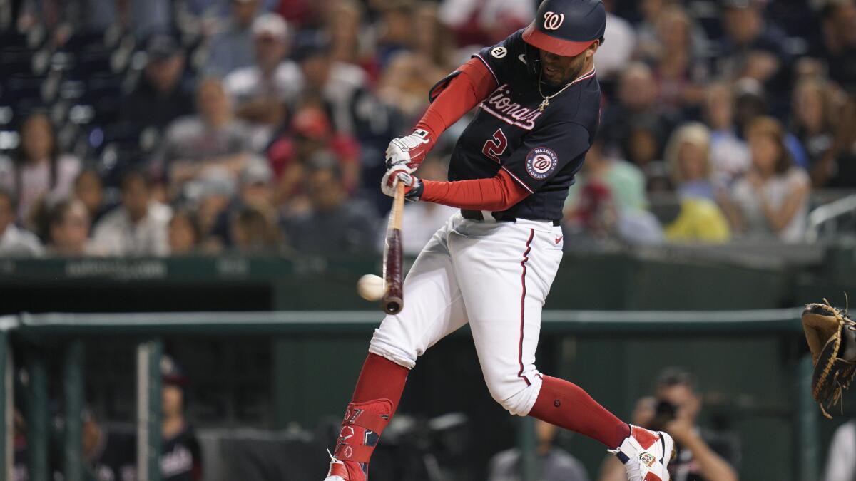 Washington Nationals' Luke Voit (34) celebrates his home run with Luis  Garcia during the third inning