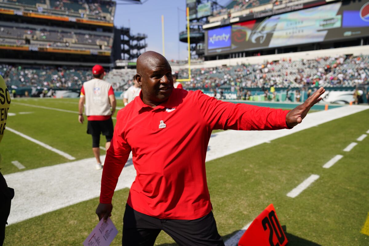 Kansas City Chiefs offensive coordinator Eric Bieniemy waves before a game against the Philadelphia Eagles on Oct. 3.