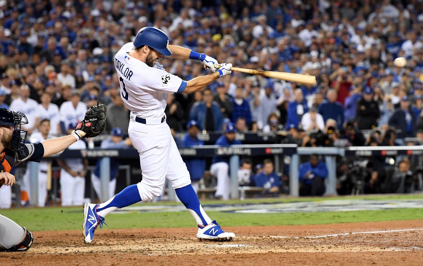 Chris Taylor hits an RBI double against the Astros in the sixth inning.