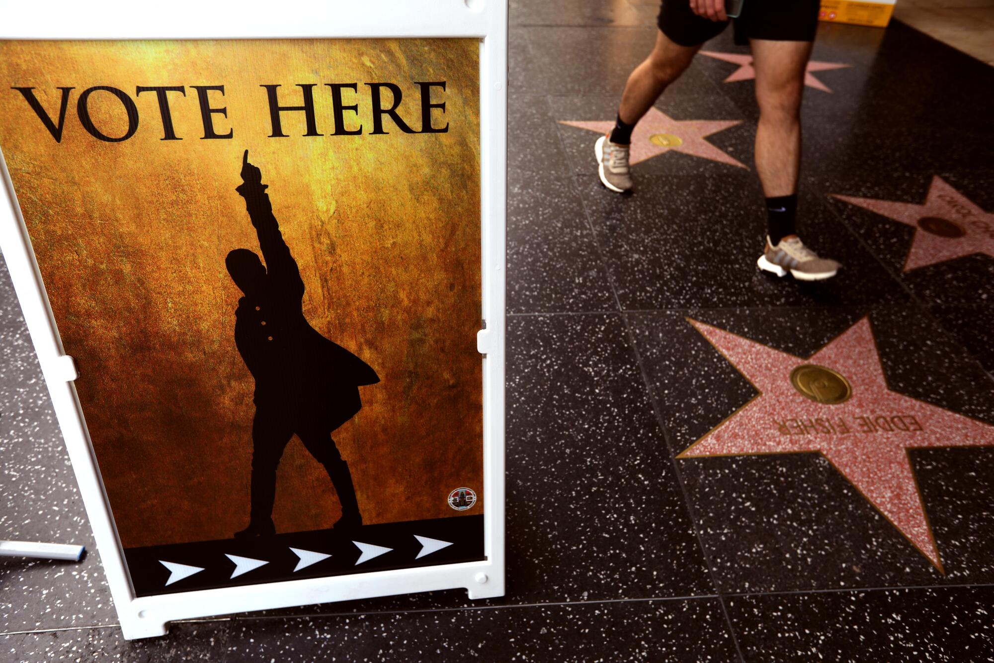 "Vote here" was added to a poster from the musical "Hamilton" to draw in voters to cast their ballots at the Pantages Theatre