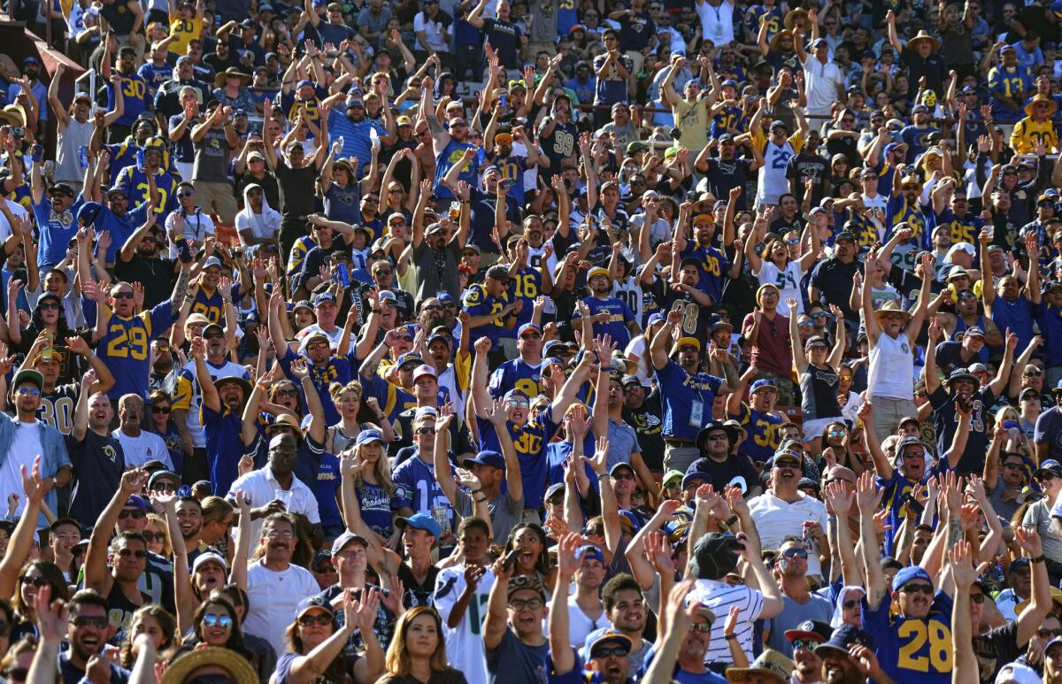 Rams fans cheer during the game against Seattle on Sept. 18.