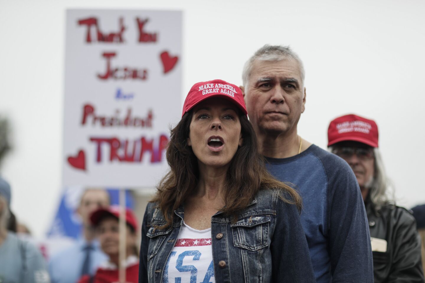 Angela and Tosh Ervin of Oceanside join supporters of President Trump at a rally near the border in San Diego.